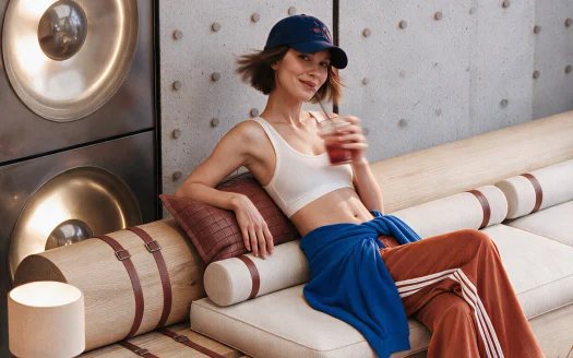 Resident relaxing in a stylish lounge at Kore by Imtiaz, Dubailand Residence Complex